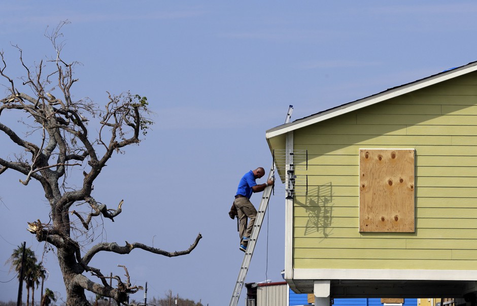 A worker repairs a Texas home after Hurricane Harvey in September 2017.