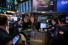 Traders work on the floor of the New York Stock Exchange (NYSE) in New York, U.S., on Monday, March 11, 2019. U.S. stocks bounced back from the worst week of the year, as chipmakers rallied on deal news and the latest retail-sales data boosted confidence that the economy isn't headed for a downturn.