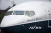 Captain Ed Wilson waves from the cockpit of a Boeing Co. Max 737 jet after landing at King County International Airport in Seattle, Washington, U.S., on Friday, Jan. 29, 2016. Boeing Co.'s newest 737 jetliner gunned its engines and headed into rain-streaked skies Friday, with profit and pride riding on its wings.