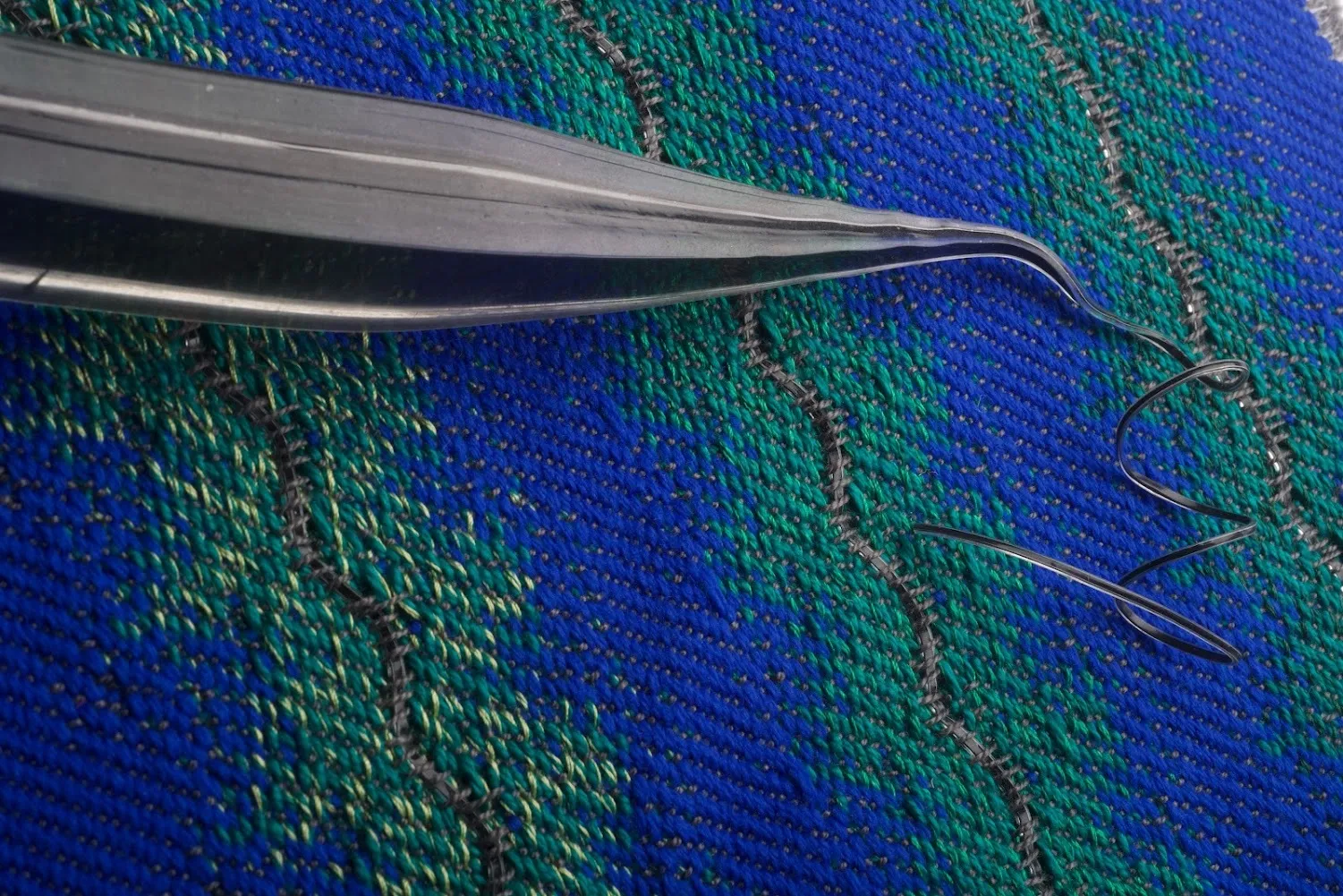 MIT photo of acoustic fiber and fabric with fiber.