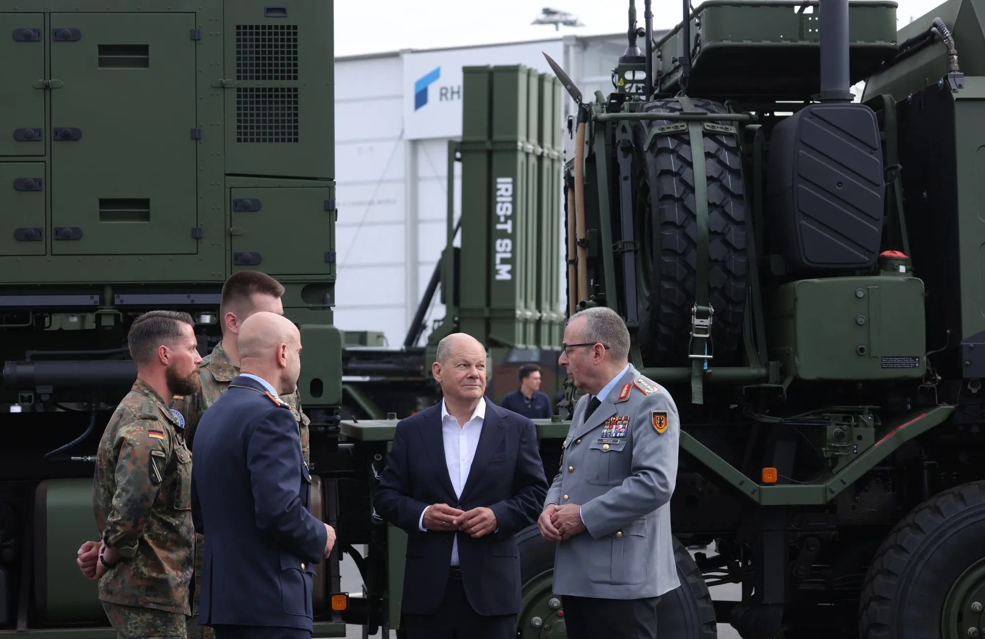 Olaf Scholz, center, near an Iris-T missile system at the Berlin Air Show in June.