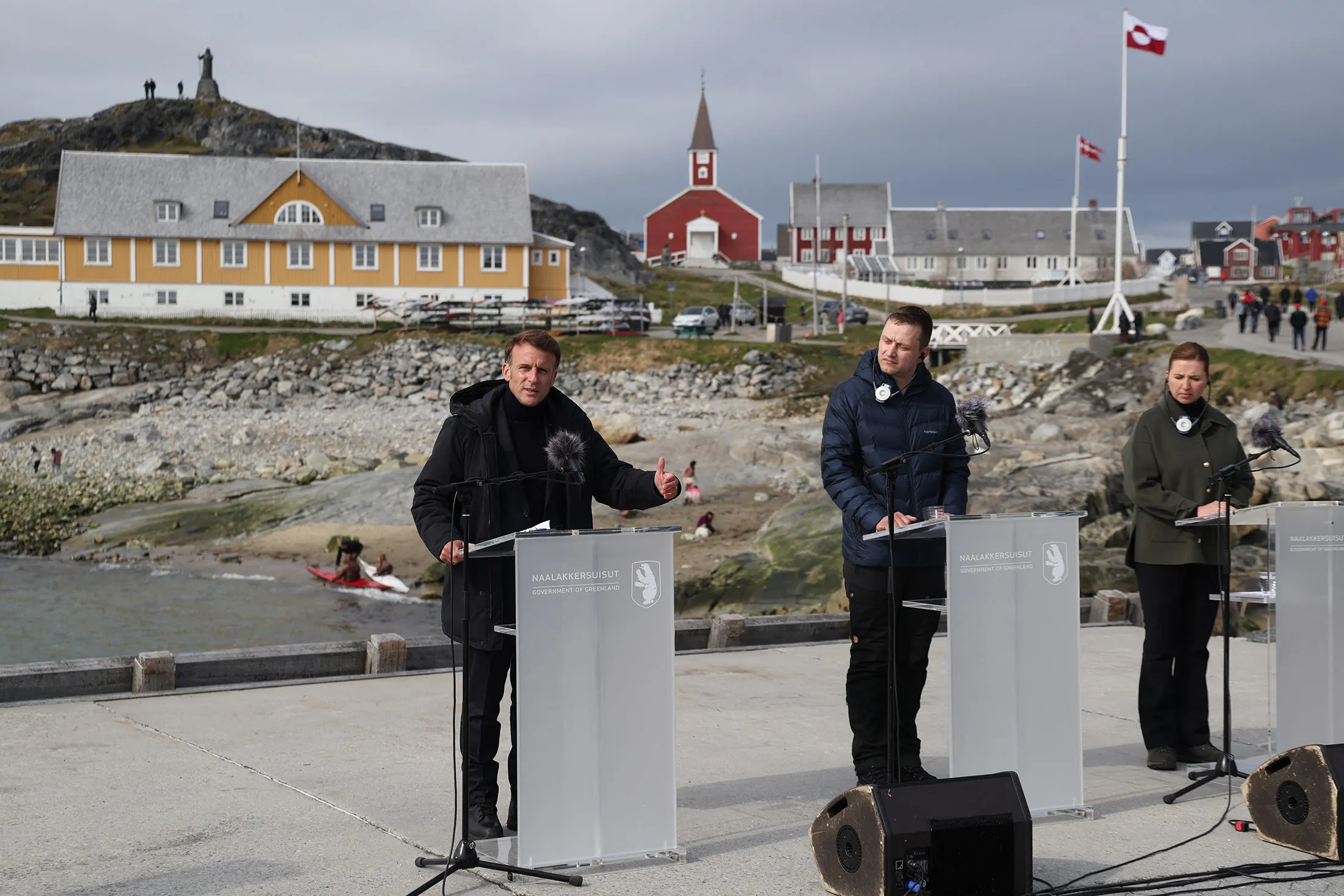 Emmanuel Macron, from left, Jens-Frederik Nielsen and&nbsp;Mette Frederiksen attend a joint press conference in Nuuk, Greenland, on June 15.