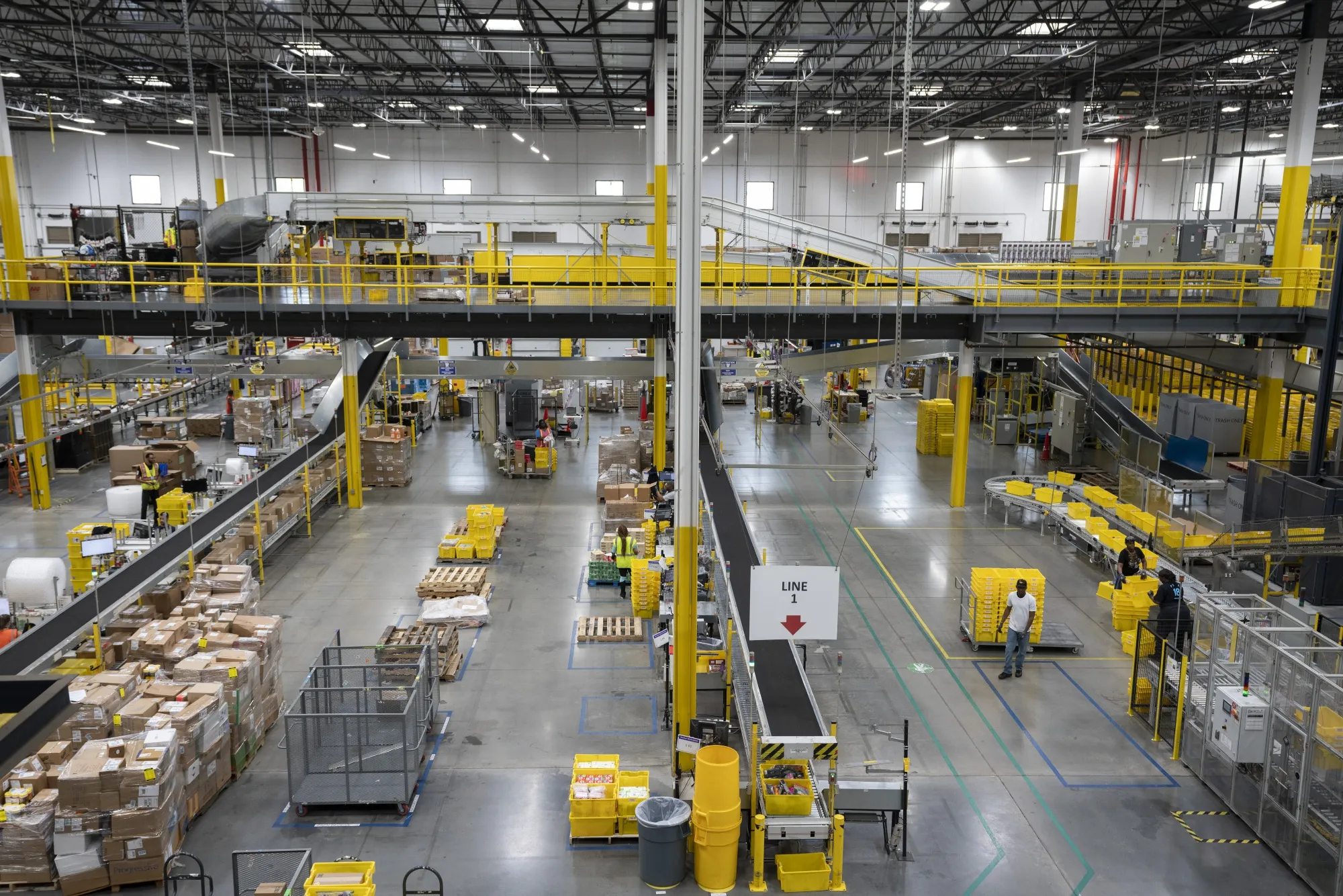 Employees work inside an Amazon.com Inc. fulfillment center.