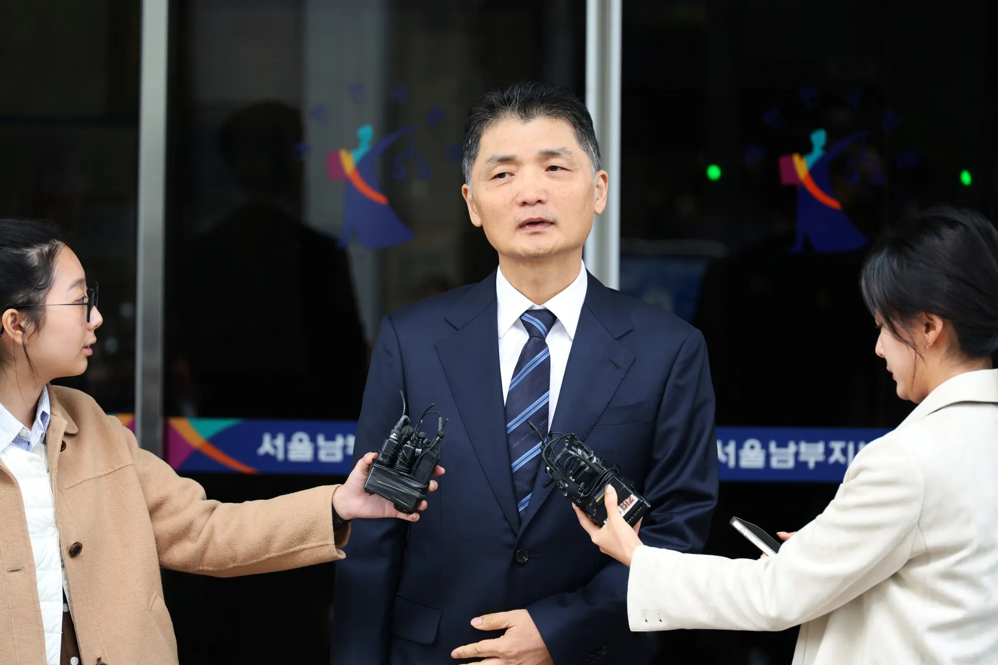Brian Kim leaves court in Seoul on Oct. 21.
