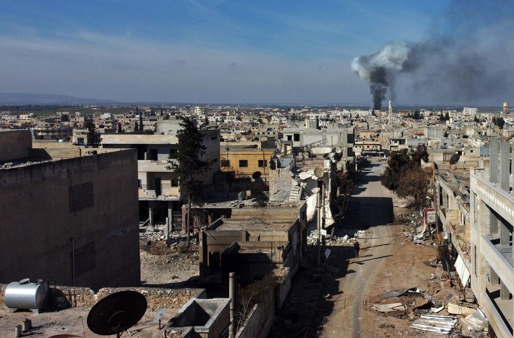 Smoke billows over the town of Saraqib in the eastern part of the Idlib province in Syria on Feb. 27.