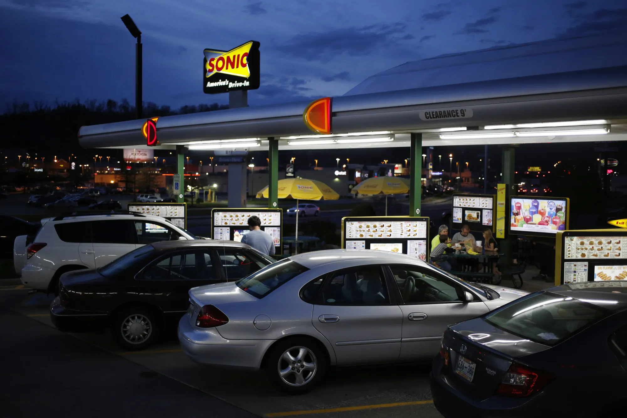 Customers dine at a Sonic Corp. drive-in fast food restaurant in Knoxville, Tennessee.
