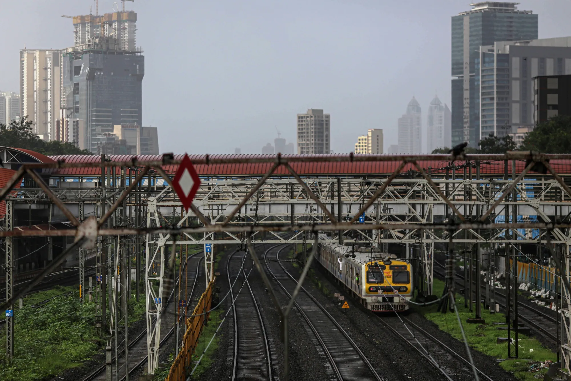 A train travels through Parel railway station in Mumbai, India.