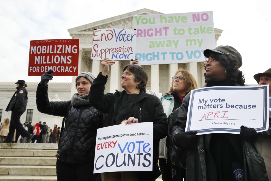People rally outside of the Supreme Court in opposition to Ohio's voter roll purges.