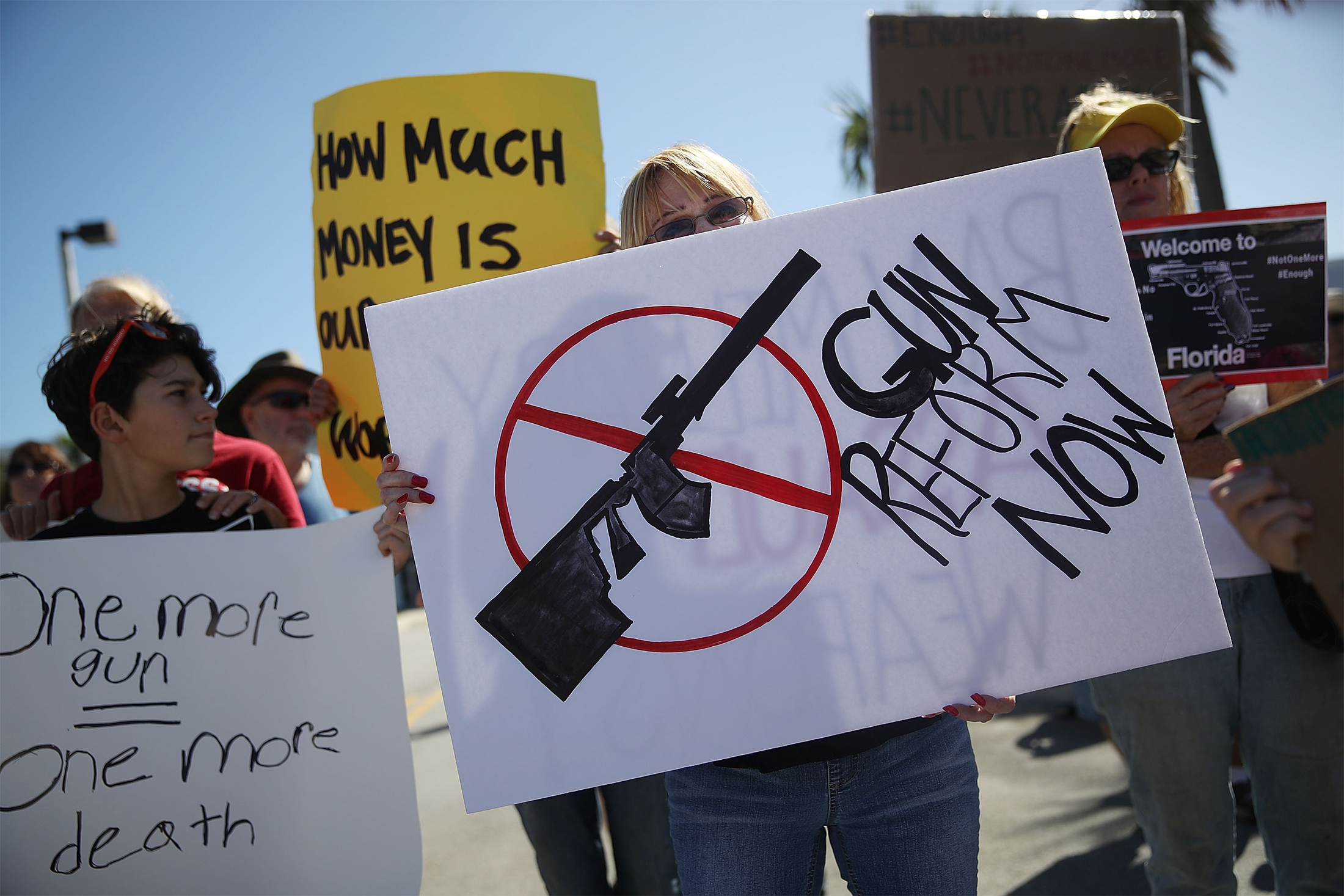 Activists protest in front of Kalashnikov USA, a gun manufacturer that makes an AK-47 rifle, in Pompano Beach, Florida on Feb. 25.&nbsp;