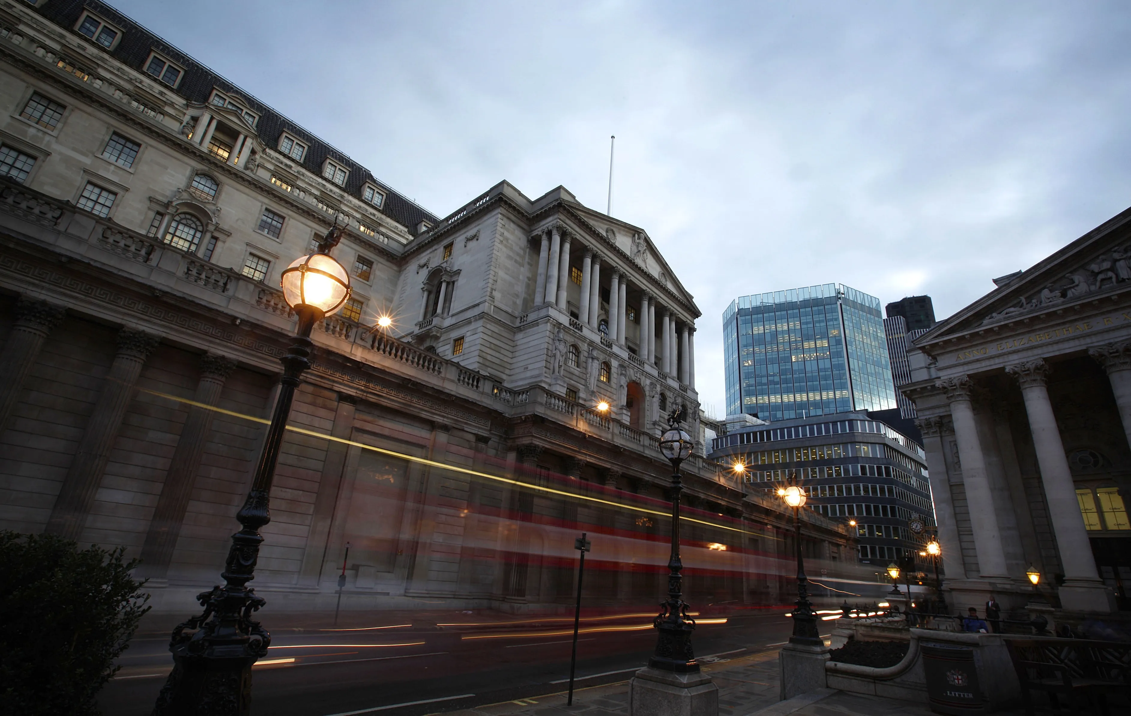Traffic streams past the Bank of England in London.