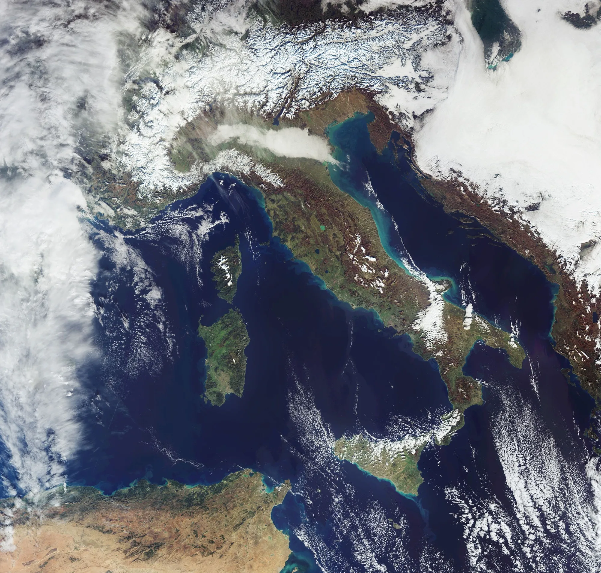 The European Space Agency’s Sentinel-3 satellite captures snow cover and clouds across the Alps on Dec. 14.