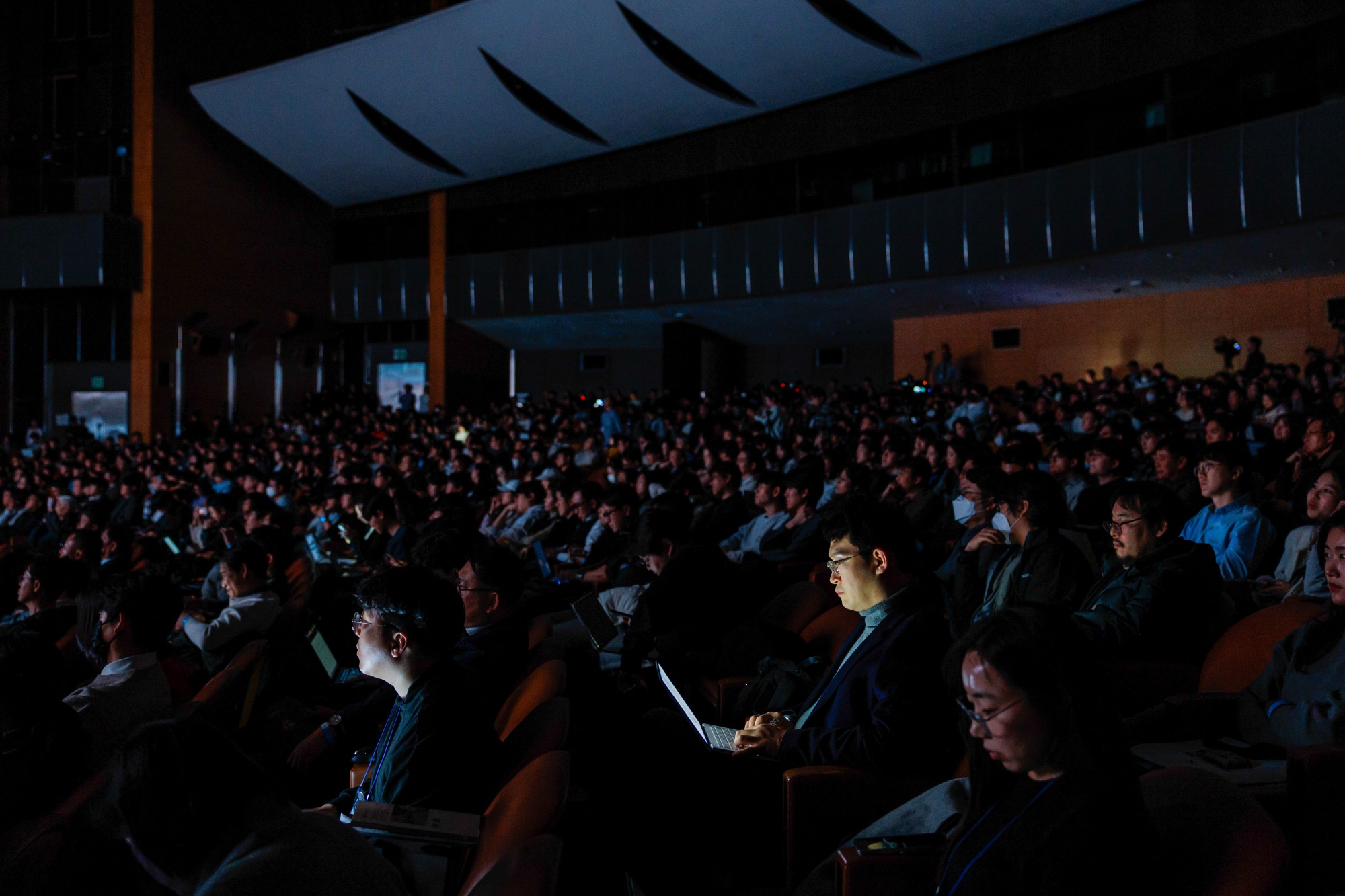 Visitors listen during the Science and ICT Ministry's first national Self-Reliant AI Foundation Model presentation event at COEX, in Seoul on Tues, Dec. 30, 2025.