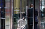 An office worker enters the JPMorgan Chase &amp; Co. headquarters in New York.