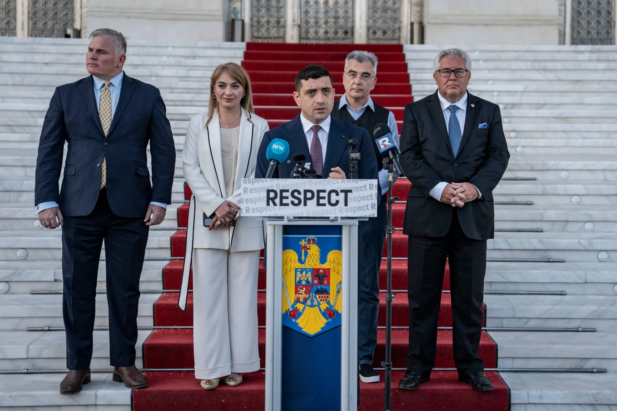 George Simion speaks during a press conference outside the Parliament building in Bucharest on May 4.