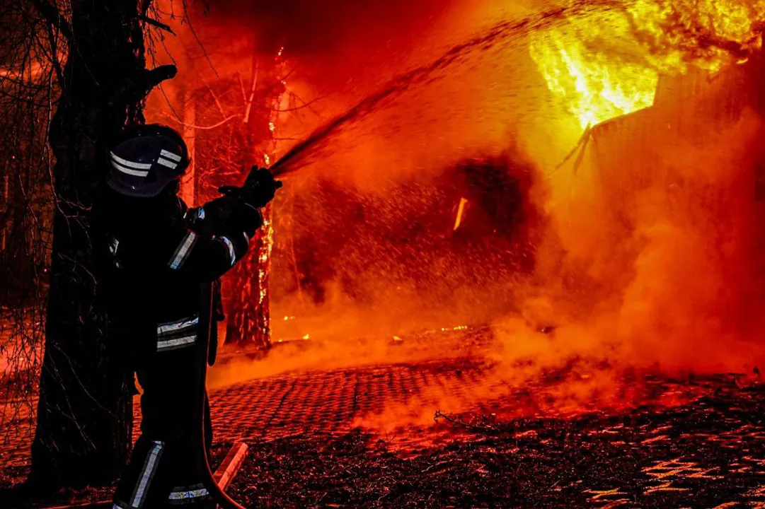 Emergency services at the scene of a Russian attack in Kharkiv, Ukraine, in a photo released on March 27.