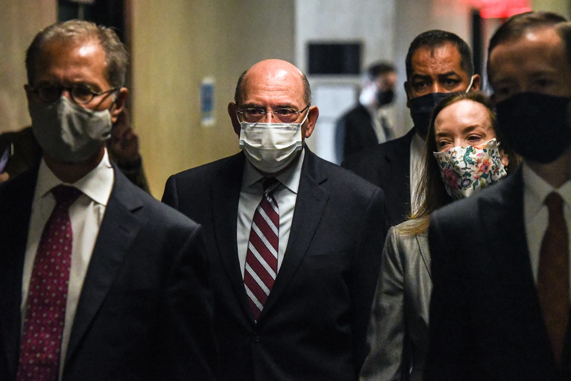 Allen&nbsp;Weisselberg, chief financial officer of Trump Organization Inc., center, walks towards the courtroom at criminal court in New York, on Sept. 20.