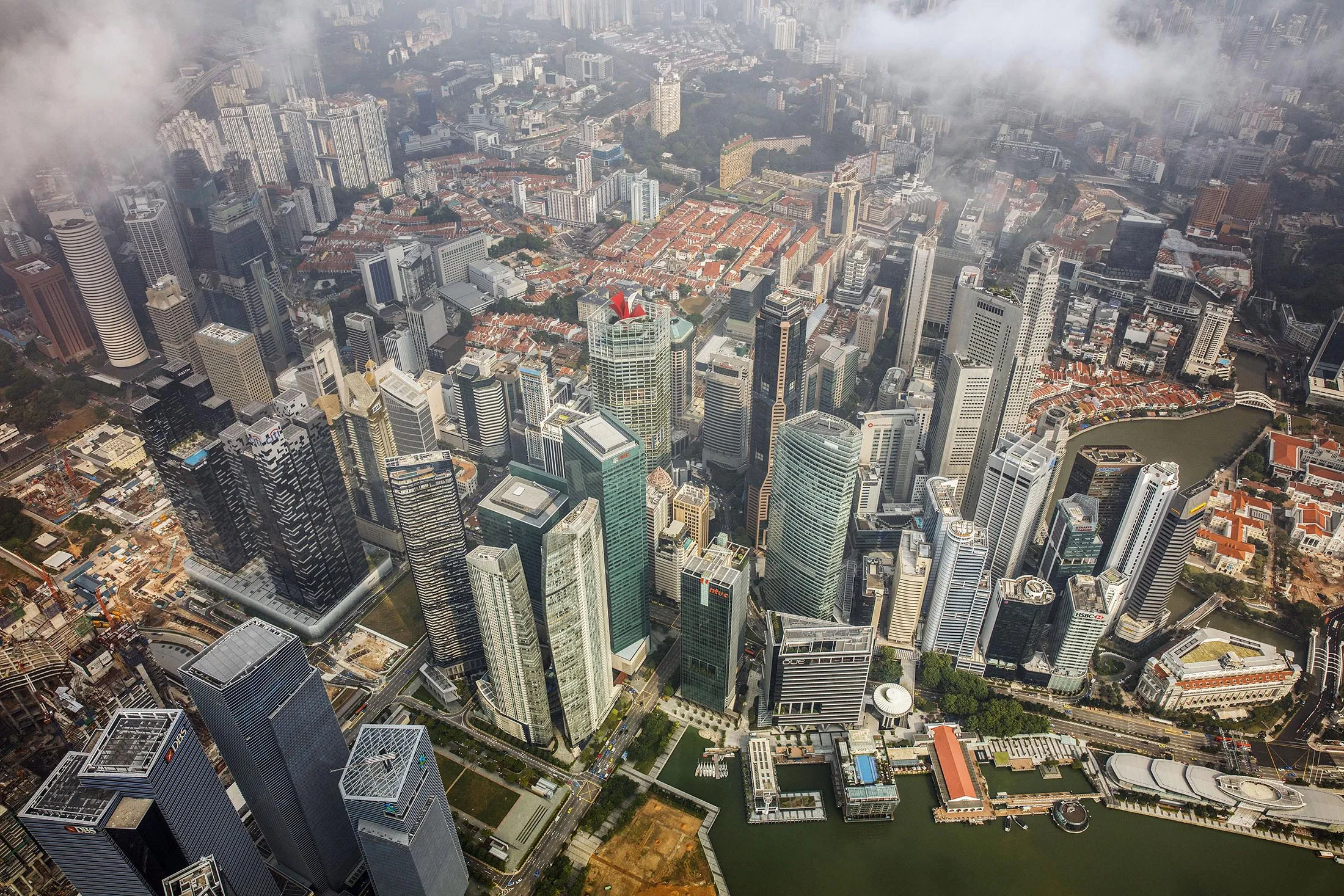 Commercial buildings in the central business district stand near Marina Bay in this aerial photograph taken above Singapore.
