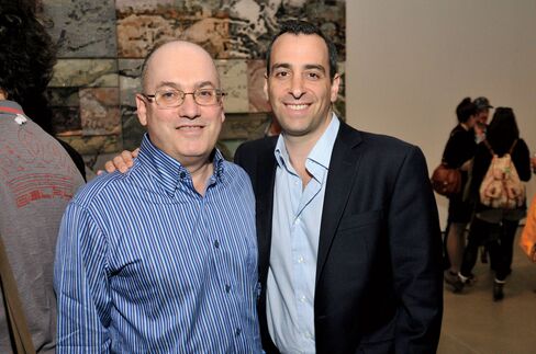 Hedge fund billionaire Steven A. Cohen, left, and art adviser Sandy Heller attend a gallery reception in 2011.