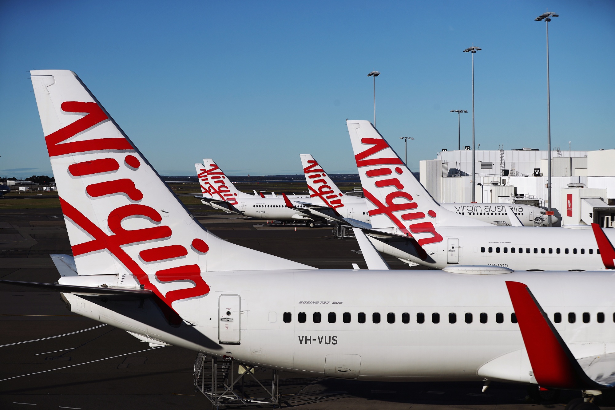 Aircraft operated by Virgin Australia Holdings Ltd. stand at Sydney Airport in Sydney, Australia, on Aug. 17.