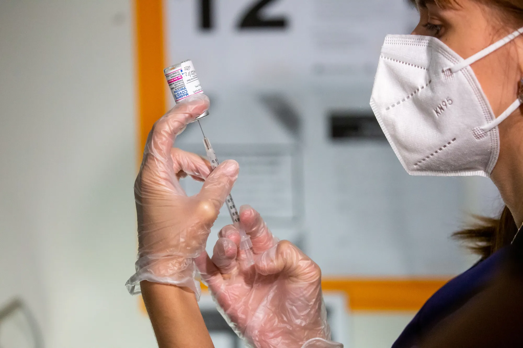 A healthcare worker prepares a dose of the Moderna Covid-19 vaccine in New York.