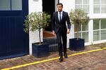 Rishi Sunak departs his home in London, on Oct. 21.