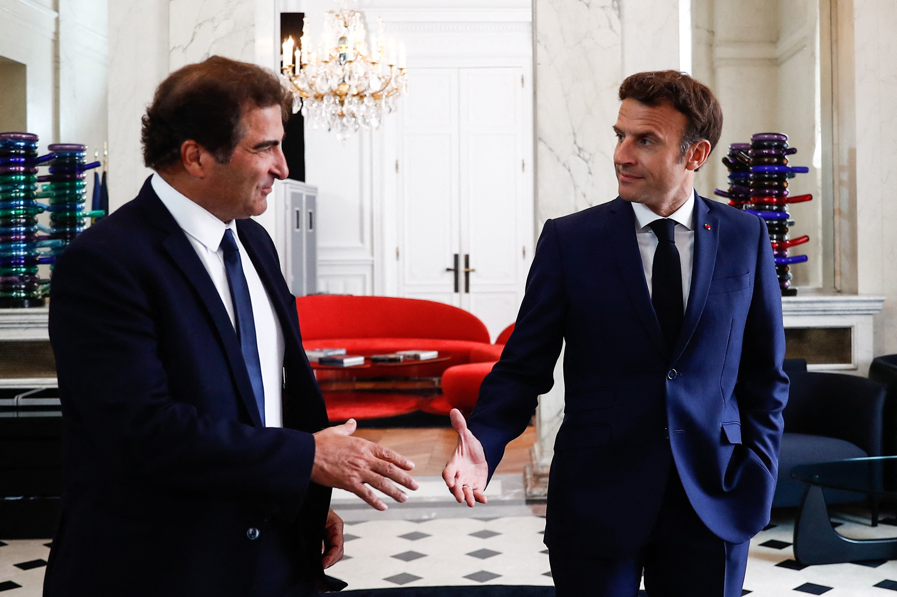 Emmanuel Macron shakes hands with Christian Jacob after a meeting at the Elysee Palace, in Paris, on June 21.