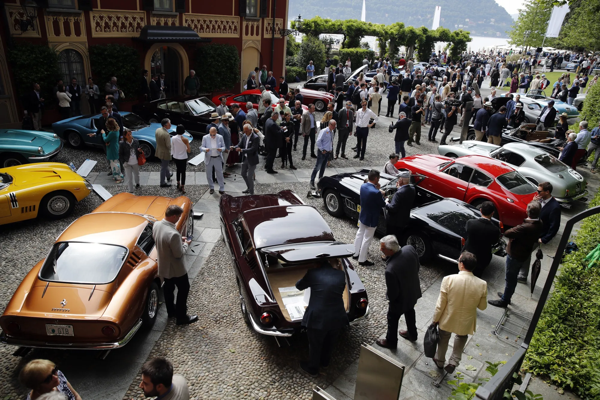 Visitors attend the 2019 Concorso d’Eleganza Villa d’Este show in Cernobbio, Italy, on Saturday, May 25, 2019. The Lake Como show, about an hour north of Milan, is one of the three highlights on the classic-car circuit each year and the only one in Europe.