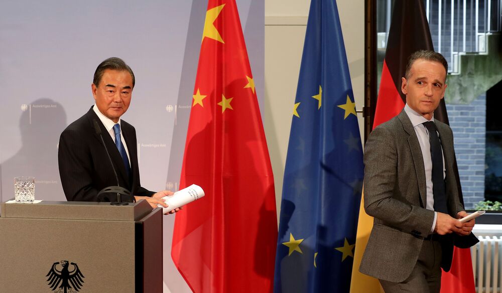 Wang Yi and Heiko Maas leave after a joint press conference in Berlin, on Sept. 1. 