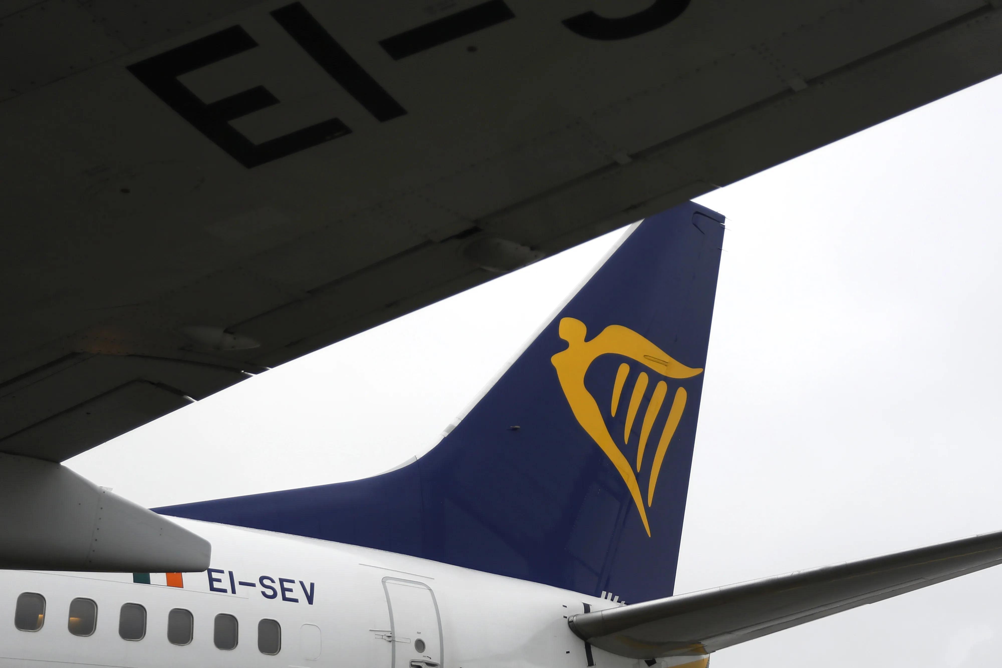 A branded tailfin sits on a Ryanair corporate jet at Dublin Airport.
