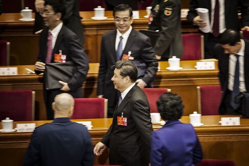 Xi Jinping leaves following the opening of the fourth session of the 12th NPC