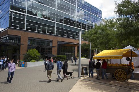 People walk outside office buildings at the Amazon headquarters in the South Lake Union neighborhood of Seattle.