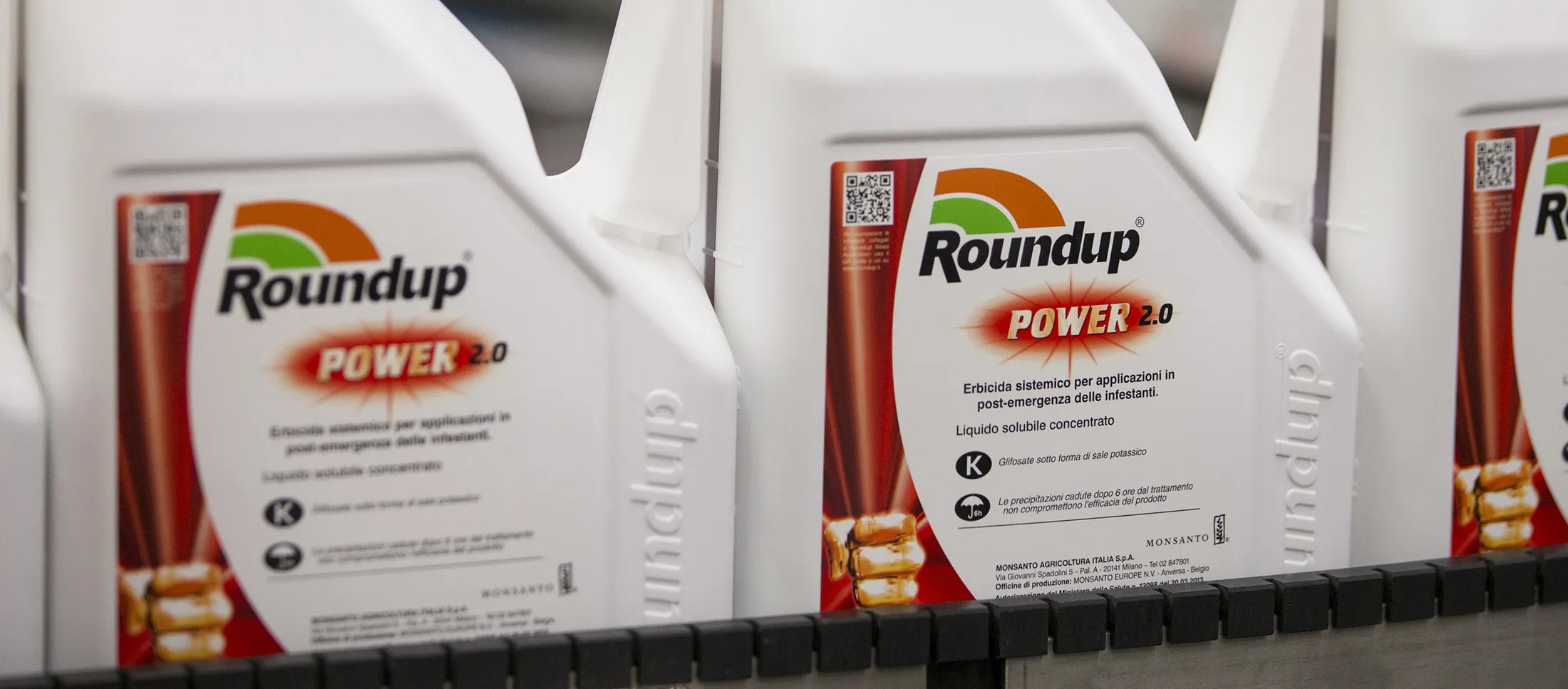Bottles of Roundup weed killer move along the production line at the herbicide manufacturing facility.