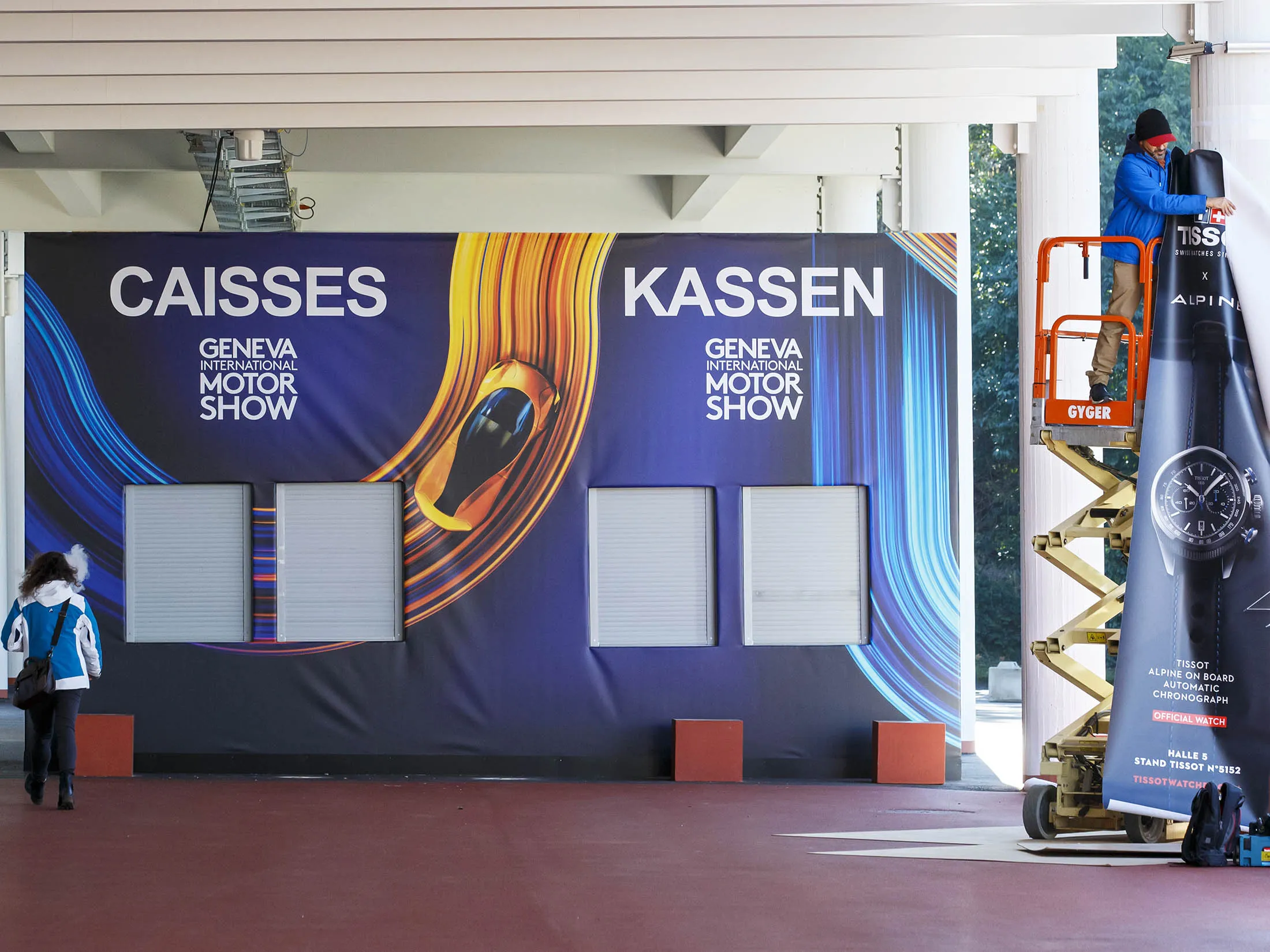 Workers stop preparations ahead of the 2020 Geneva Motor Show, on Feb. 28.