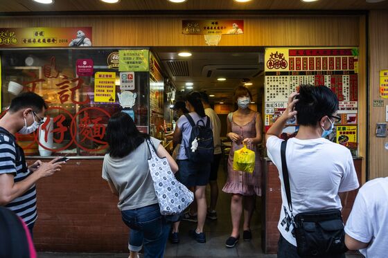 Hong Kong Faces Worst Wave of Virus, But It Can’t Lock Down