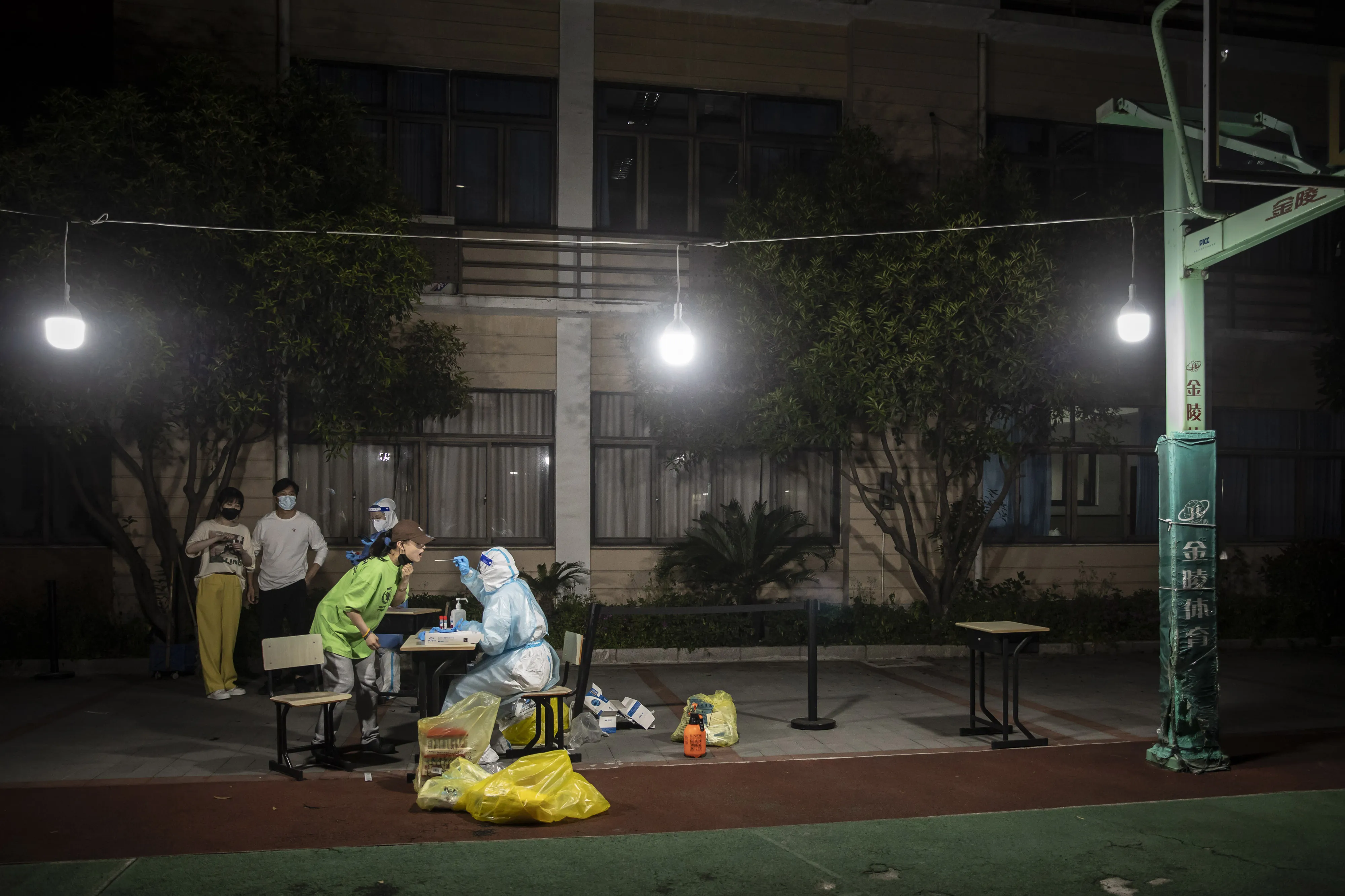 Residents take part in a round of Covid-19 testing in a neighborhood placed under lockdown in Shanghai, on April 12.