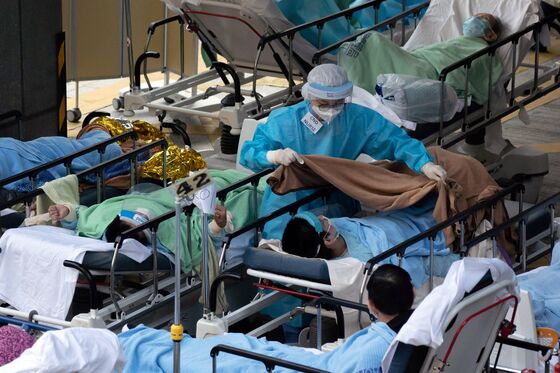 Overflowing Hong Kong Hospitals Forced to Put Covid Beds Outside