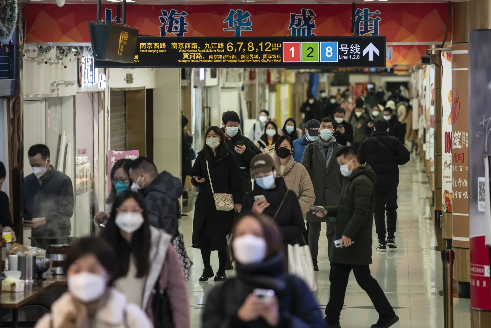Commuters at a subway station in Shanghai.