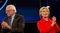 Hillary Clinton and Senator Bernie Sanders stand on stage together during candidate introductions at the Jefferson-Jackson Dinner in Des Moines, Iowa, on Oct. 24, 2015.