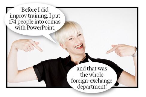 Trainers and executives from Second City Works do an improv exercise called repetition.