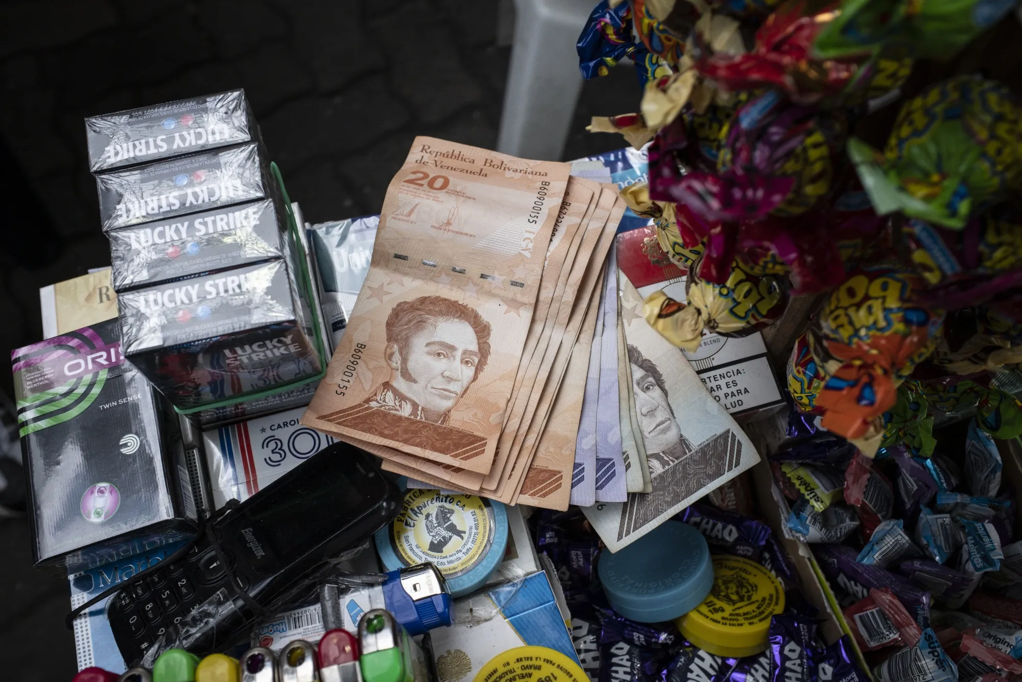 Venezuelan policymakers have been spending dollars to prevent the bolivar from weakening too fast.
