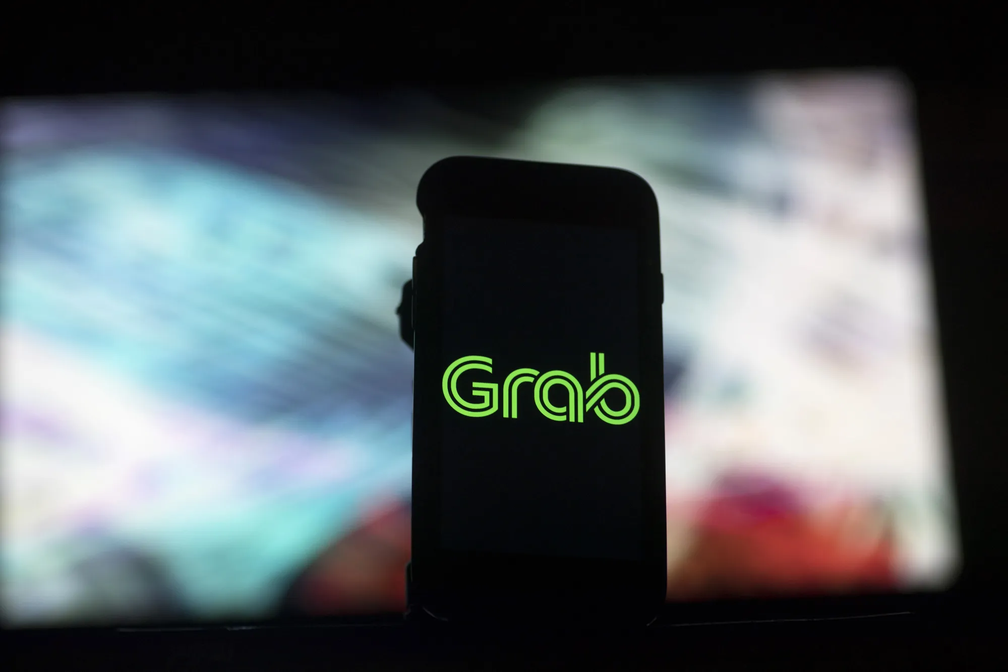 Views Of The Grab Application as Grab Looks To Acquire Uber's Business In Southeast Asia