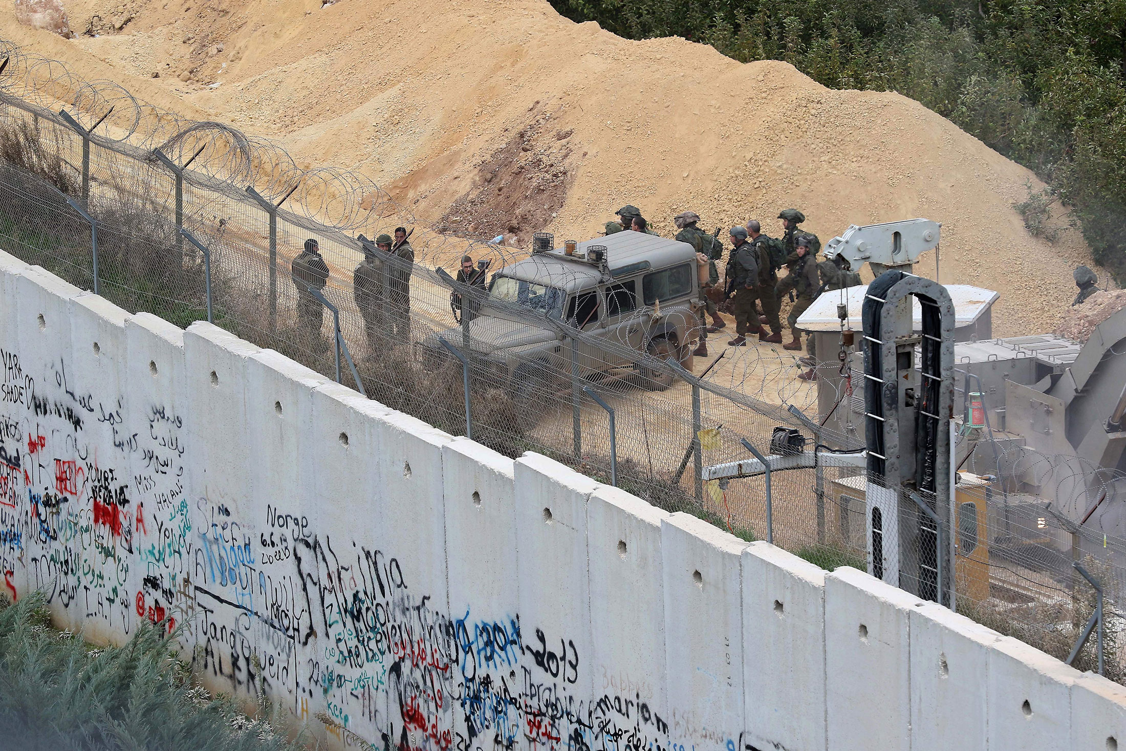 Israeli soldiers gather at the Lebanon-Israel border near reported cross-border tunnels, on Dec. 5.