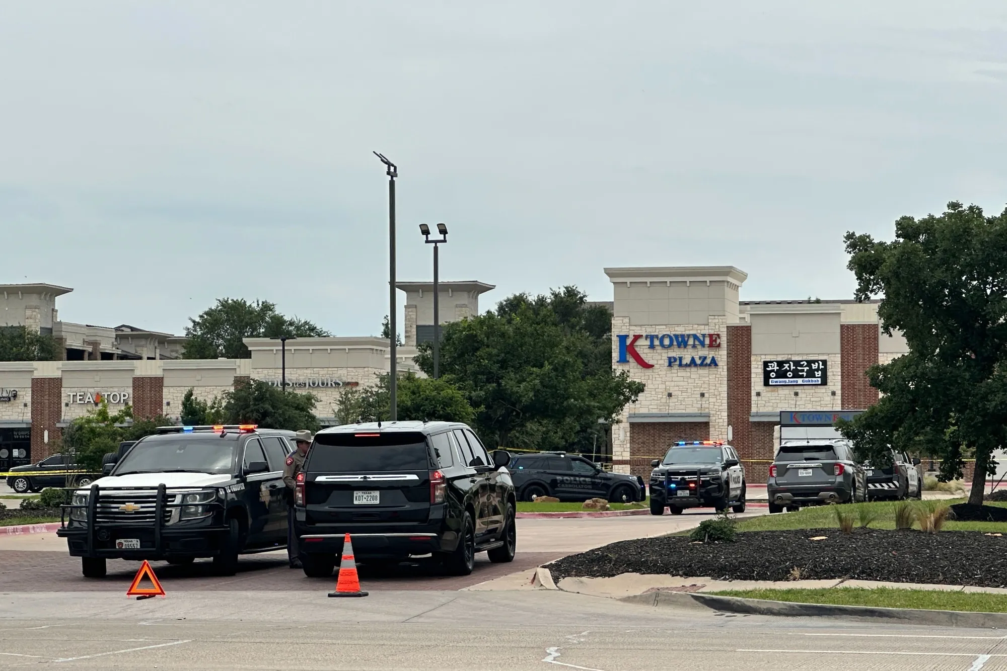 Law enforcement responds to the scene of a shooting at K Towne Plaza in Carrollton, Texas on May 5.&nbsp;