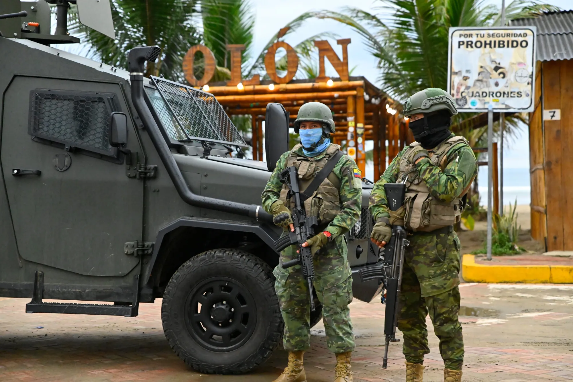 Members of the military stand guard near the polling station where President Daniel Noboa voted&nbsp;during the general elections in Olon, Ecuador, on&nbsp;Feb. 9.