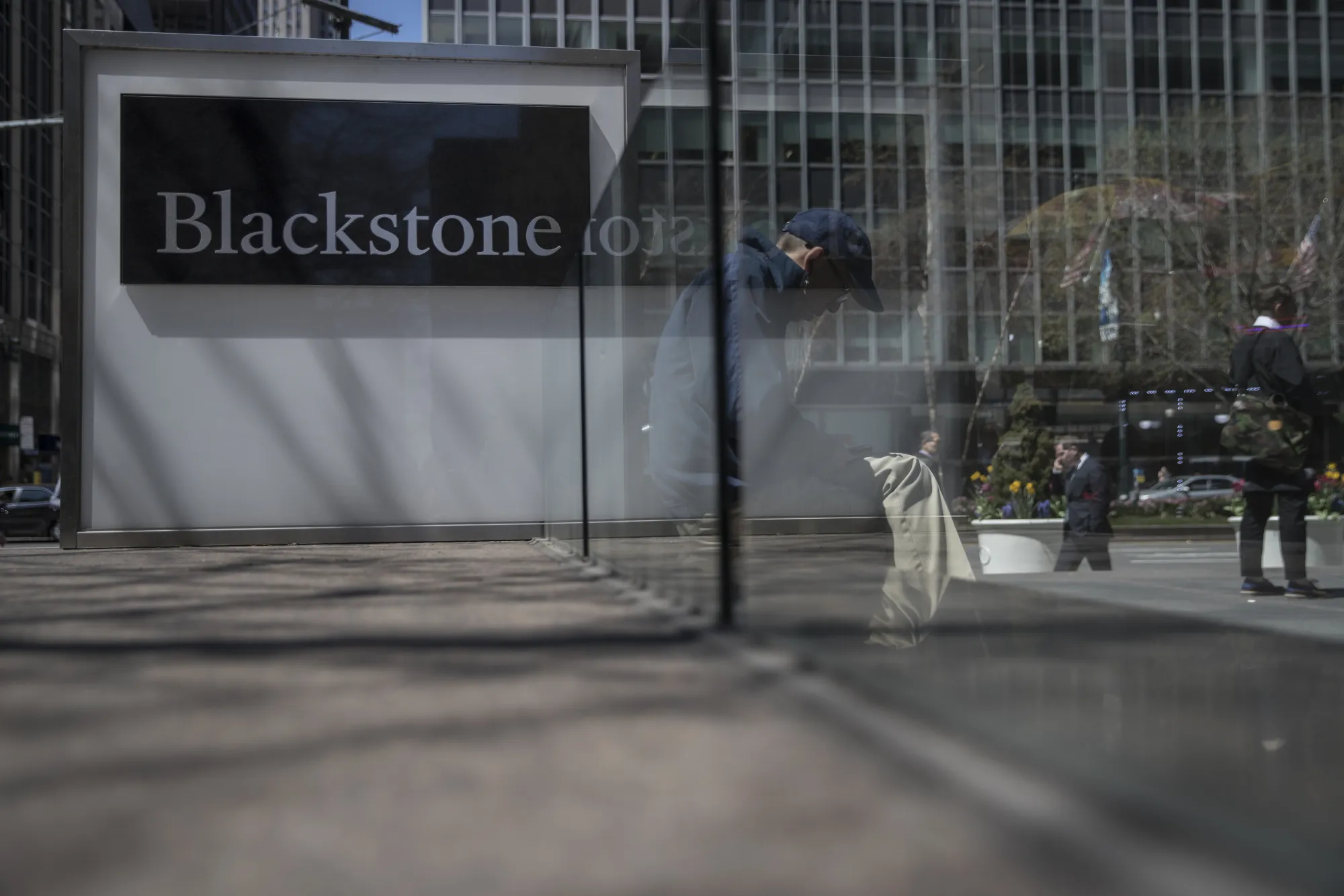 Pedestrians pass in front of Blackstone Group LP headquarters in New York.