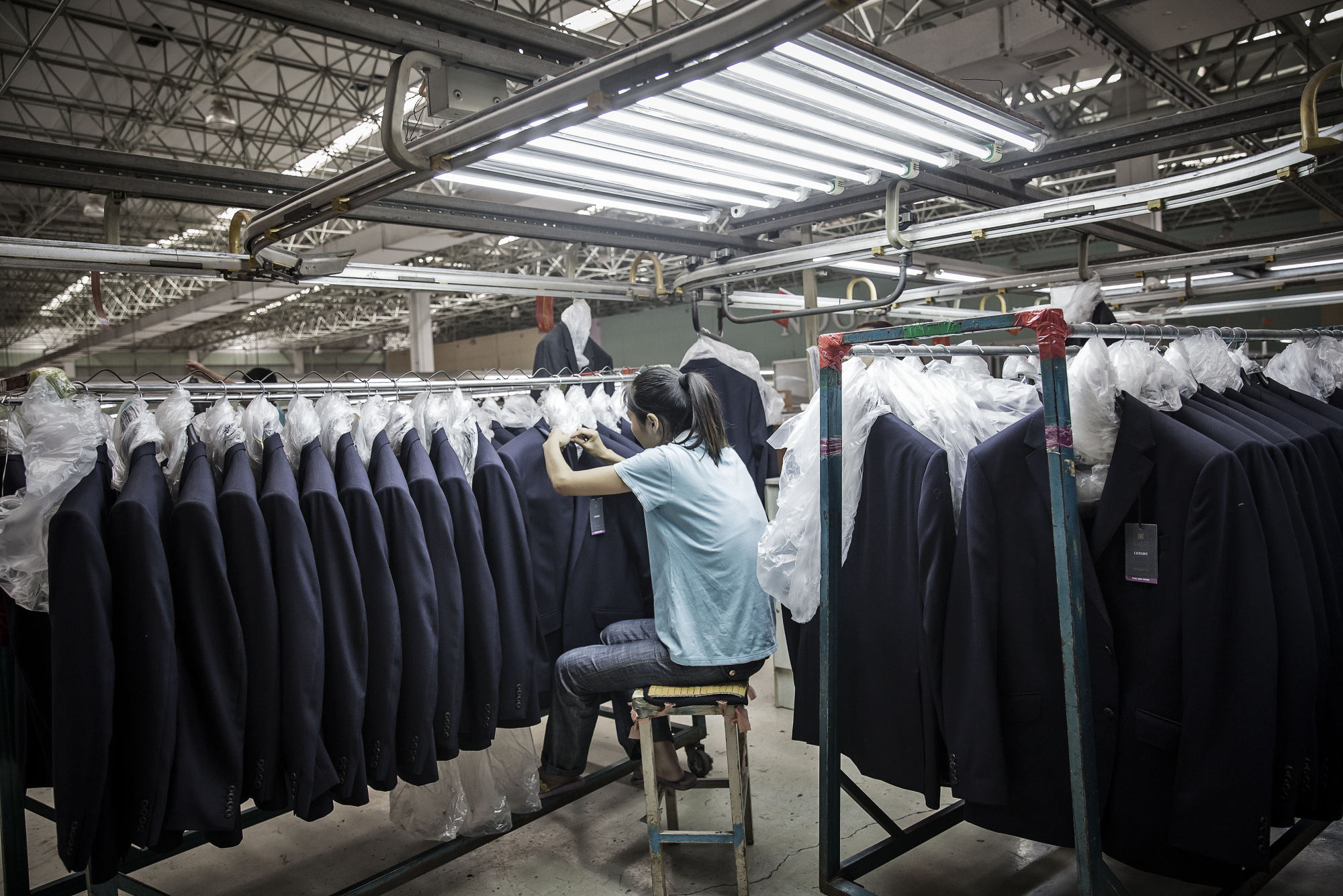 Suit jackets at a&nbsp;Shandong Ruyi Group factory in Jining, China.