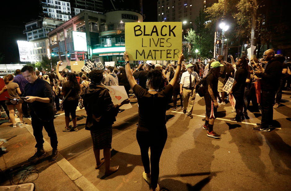Protesters take to the streets of uptown Charlotte during a peaceful march following Tuesday's police shooting of Keith Lamont Scott, Thursday, Sept. 22, 2016.