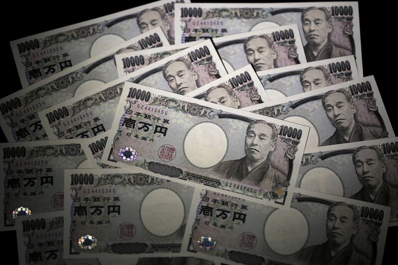 Japanese 10,000 yen banknotes are arranged for a photograph in Tokyo, Japan