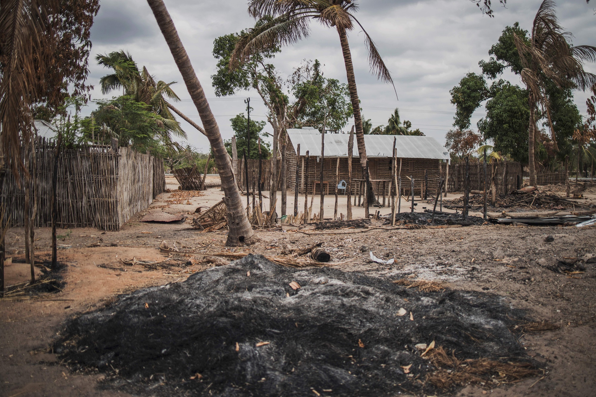 A mound of ashes sits following an attack by insurtents in the village of Aldeia da Paz outside Macomia, Mozambique.&nbsp;