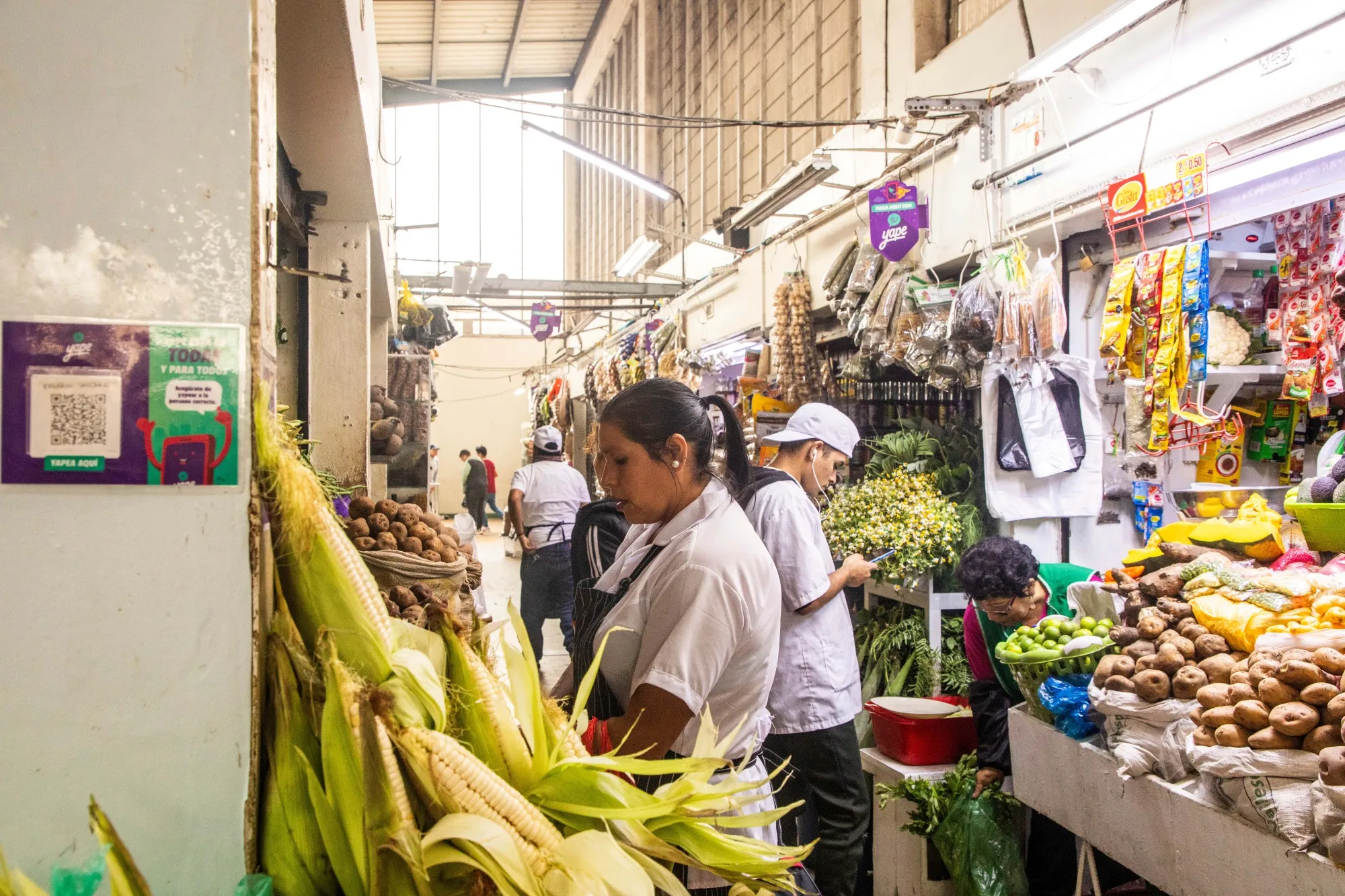 Vendors organize stalls at the Mercado Central in Lima, Peru.